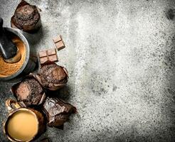 Chocolate muffins with coffee and cocoa. photo