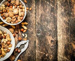 Nuts with Nutcracker in a bowl photo