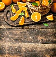 Sliced pieces of oranges in the basket. photo