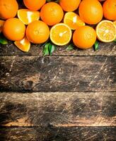 Fresh oranges with green leaves. photo