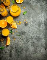 Freshly squeezed orange juice with pieces of fruit . photo