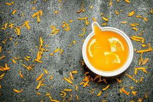 Freshly squeezed orange juice with pieces of fruit . photo