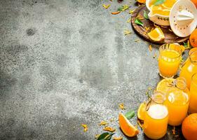 Freshly squeezed orange juice with pieces of fruit . photo