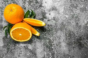 Fresh oranges with leaves. photo