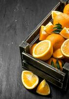 Fresh oranges in an old box. photo