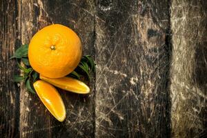 Fresh oranges with leaves. photo