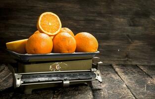 Ripe oranges on the scales. photo