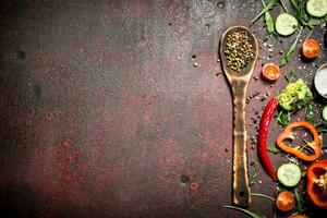 Organic Food. Diced fresh vegetables and spices. On rustic background. photo