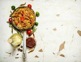 Spaghetti with tomato sauce and vegetables. photo