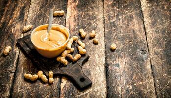 Peanut butter with nuts. photo