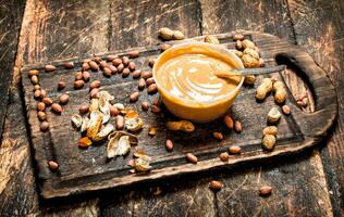 Peanut butter with nuts. photo