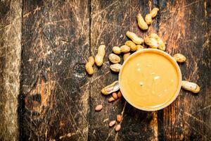 Peanut butter with nuts. photo