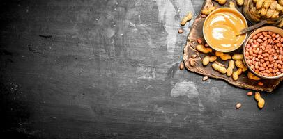 Peanut butter with nuts in a bowl. photo