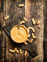 Peanut butter with nuts. photo