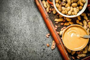 Nuts and peanut butter in a bowl. photo