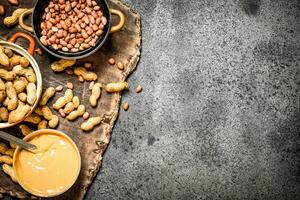 Nuts and peanut butter in a bowl. photo