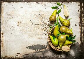 Pears in a basket with leaves .  Free space for text . photo