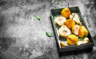 Pear pieces in a box. photo