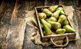 Fresh pears on an old tray. photo