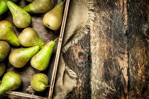 Fresh pears on an old tray. photo