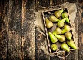 Fresh pears on an old tray. photo