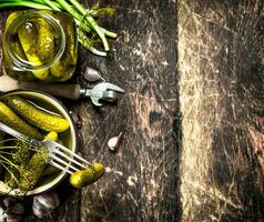 Pickled cucumbers with herbs and spices. photo