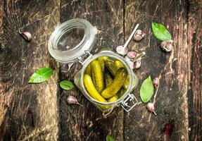 Pickled cucumbers with herbs and spices. photo