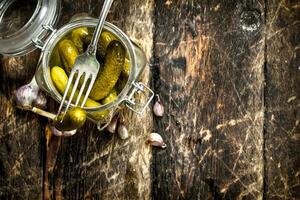 Pickled cucumbers with herbs and spices. photo