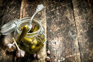 Pickled cucumbers with herbs and spices. photo