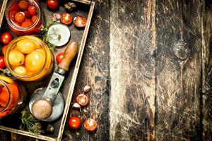 Marinated tomatoes with spices in an old tray. photo