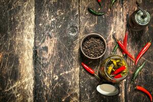 Pickled chili peppers with spices. photo