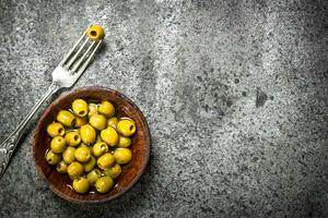 Marinated olives in a bowl. photo