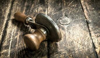 Old seamer. On wooden background. photo