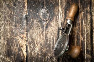 Old seamer. On wooden background. photo