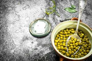 Marinated green peas in a bowl. photo