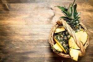 Fresh pineapples in the basket. photo