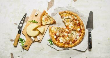 Cheese pizza with herbs and fresh cheese. photo