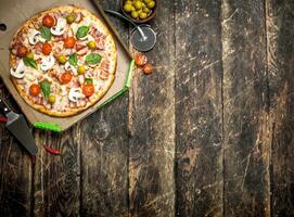 Pizza with fresh vegetables in a box. photo