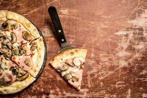 Mushroom pizza with ham. photo