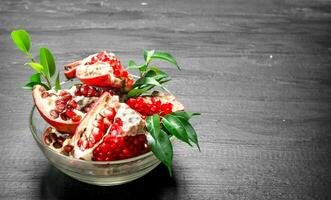 Fresh pieces of pomegranate in a bowl. photo