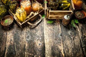 Different preserved vegetables from vegetables and mushrooms in glass jars. photo