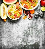 Tropical food . Fresh salad of fruits. photo