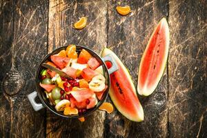 Summer food . Fruit salad in a bowl. photo