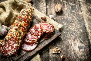 Salami with garlic and nuts. photo