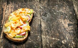 Vegetarian sandwich with cheese, radish and fresh herb sauce. photo