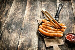 Hot sausages with tomato sauce. photo