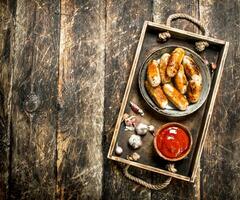 Hot sausages with tomato sauce. photo