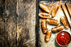 Hot sausages with tomato sauce. photo