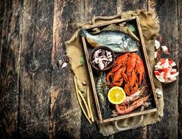 Seafood in an old tray. photo