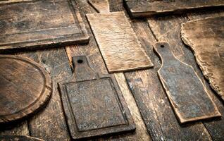 Serving background. Different old cutting Board. photo